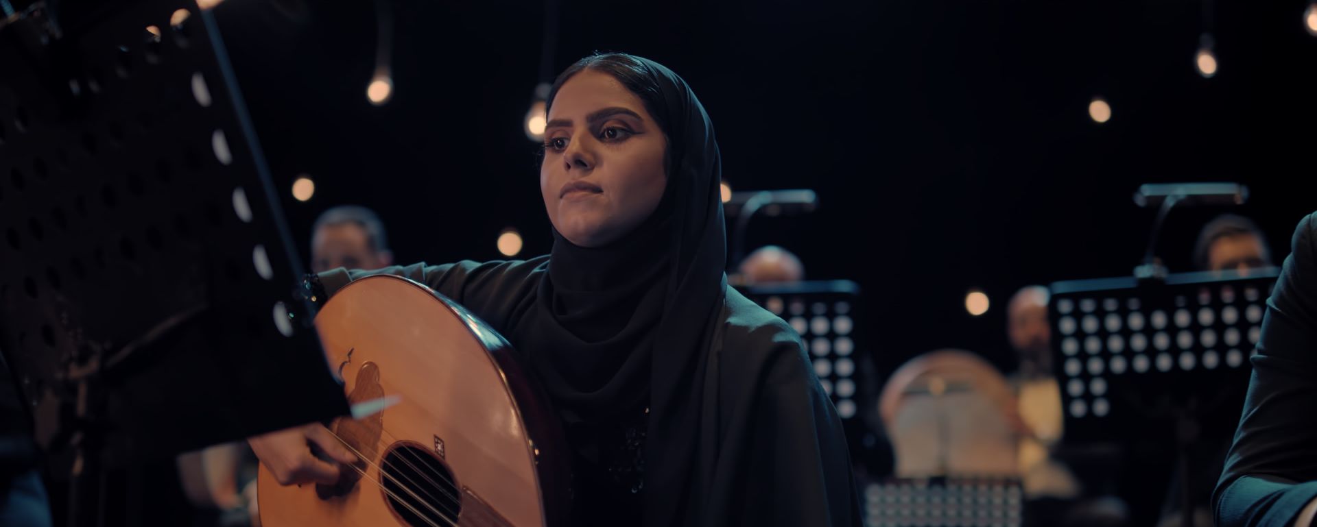An oud player in the orchestra